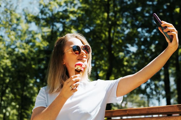 beautiful-young-woman-in-glasses-eats-ice-cream-an-2022-04-07-20-07-50-utc