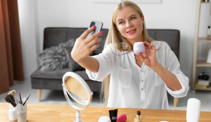 medium-shot-woman-holding-smartphone-1-1