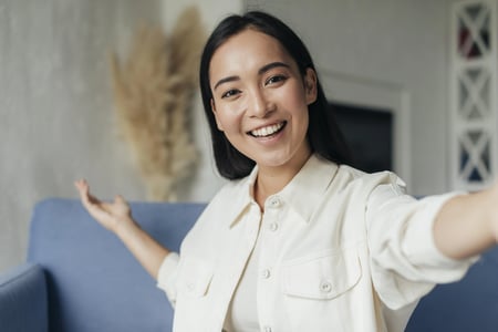 smiley-woman-live-streaming-with-her-phone